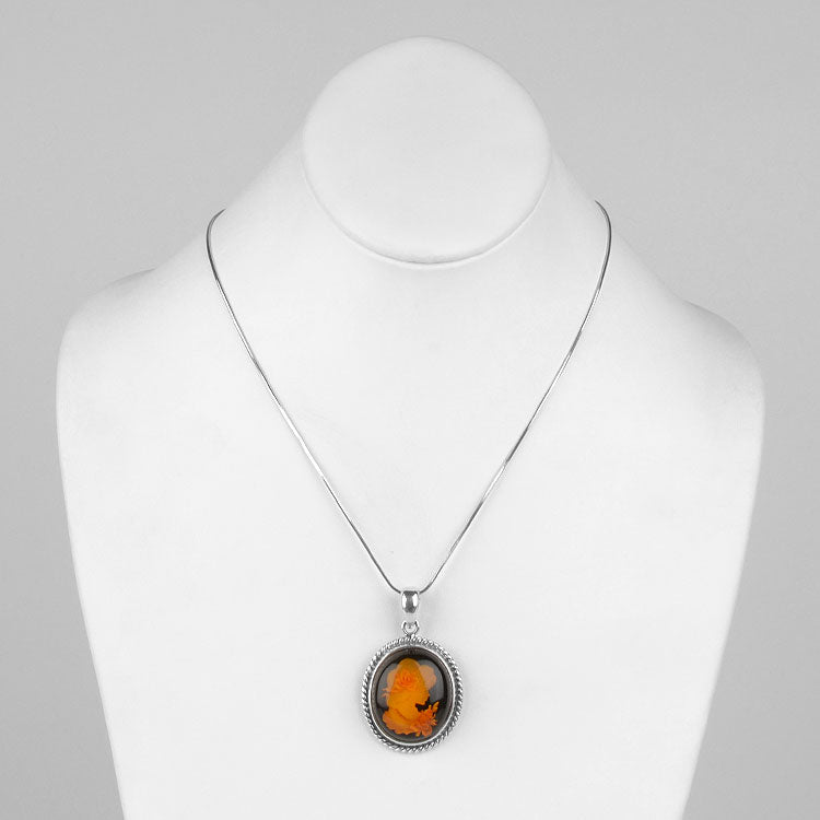 Intaglio Amber Profile Pendant