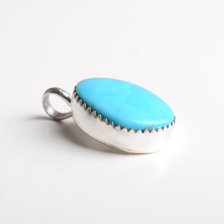 Little Turquoise Stone in Silver Pendant