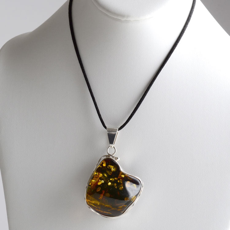 Very Special Large Green Amber and Silver Pendant. – Smithsonia