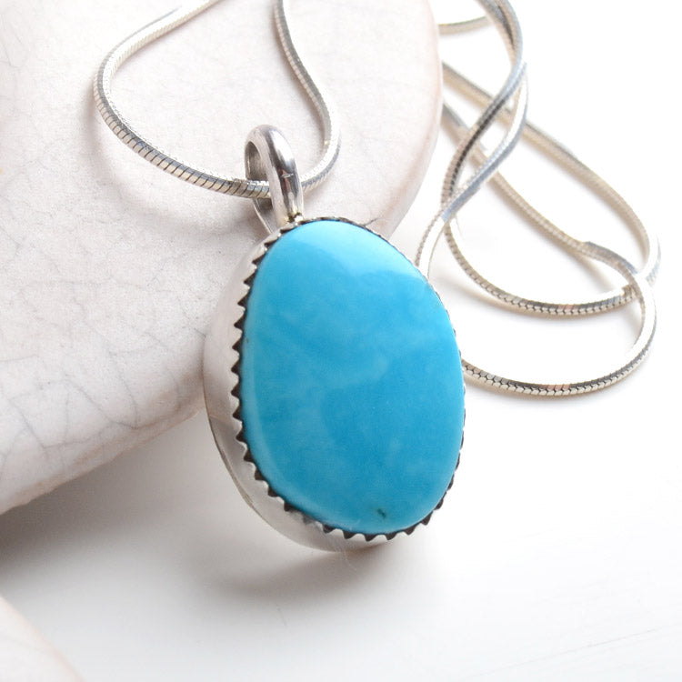 Little Turquoise Stone in Silver Pendant